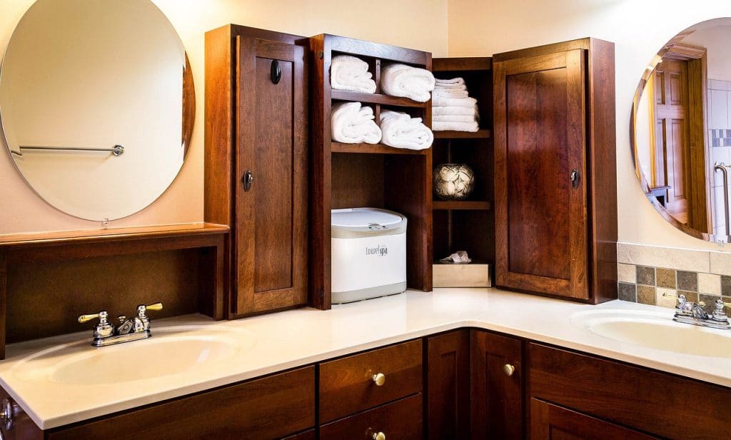 tall wooden cabinets in a bathroom