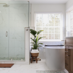 Small bathroom remodel in Aldie with brown cabinets and white walls
