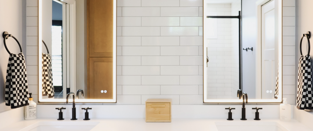 Black and white bathroom remodel in Leesburg with modern fixtures and minimalist design