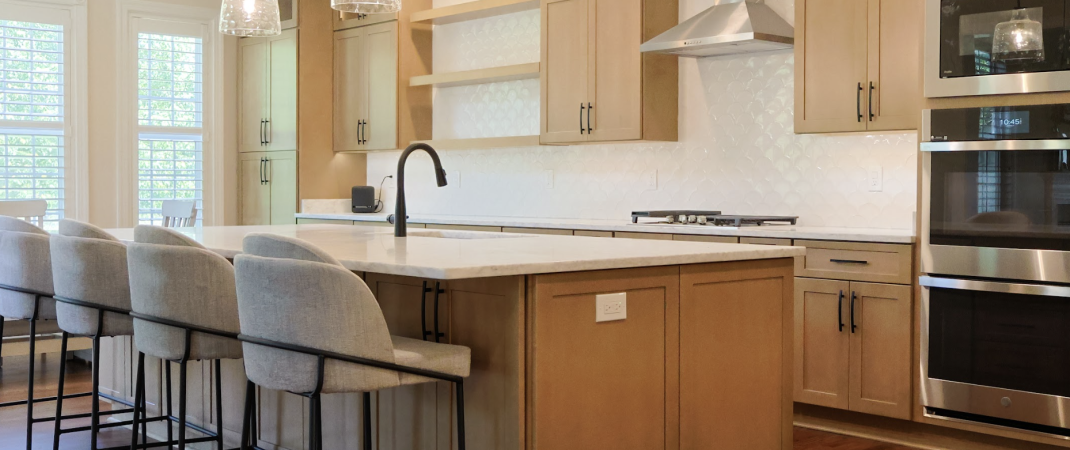 Warm and spacious kitchen remodel in Leesburg designed for a big family, featuring wood cabinetry and open layout.